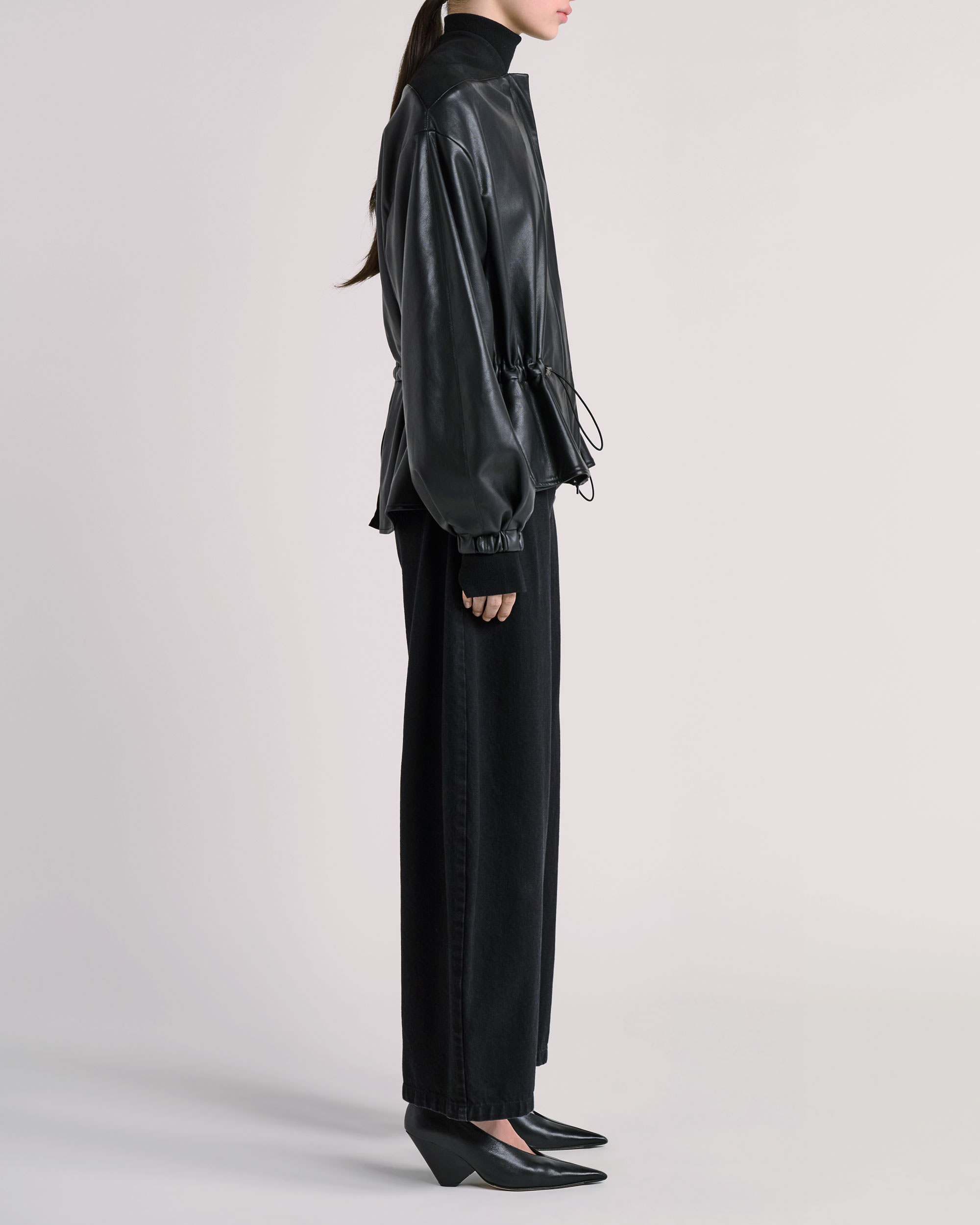 Side view of ESSE jacket photographed for fashion e-commerce