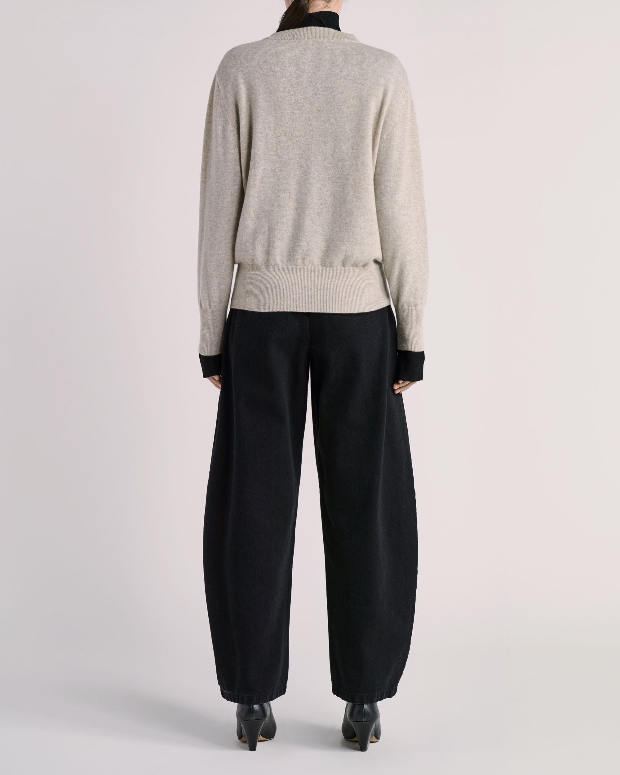Back view of ESSE knitwear photographed for fashion e-commerce