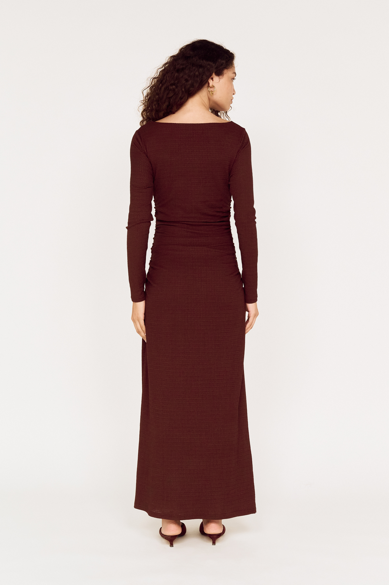 Back view of a model wearing a MINKPINK brown wrap maxi dress photographed for fashion e-commerce by Shoot.Studio in Sydney.