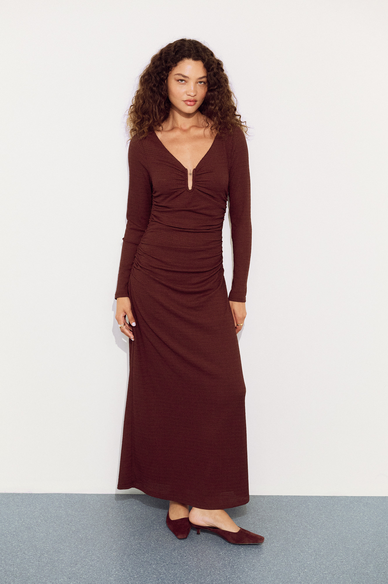 Campaign-style photograph of a model wearing a MINKPINK brown wrap maxi dress photographed by Shoot.Studio in Sydney.