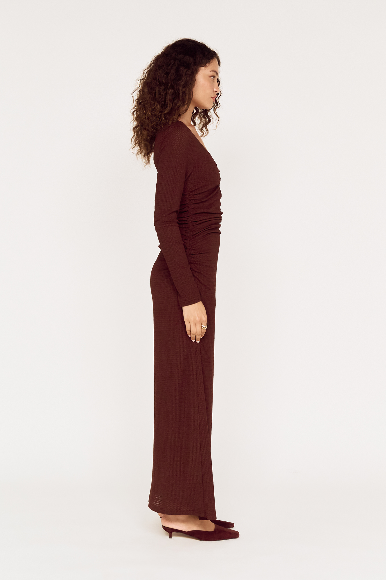 Side view of a model wearing a MINKPINK brown wrap maxi dress photographed for fashion e-commerce by Shoot.Studio in Sydney.