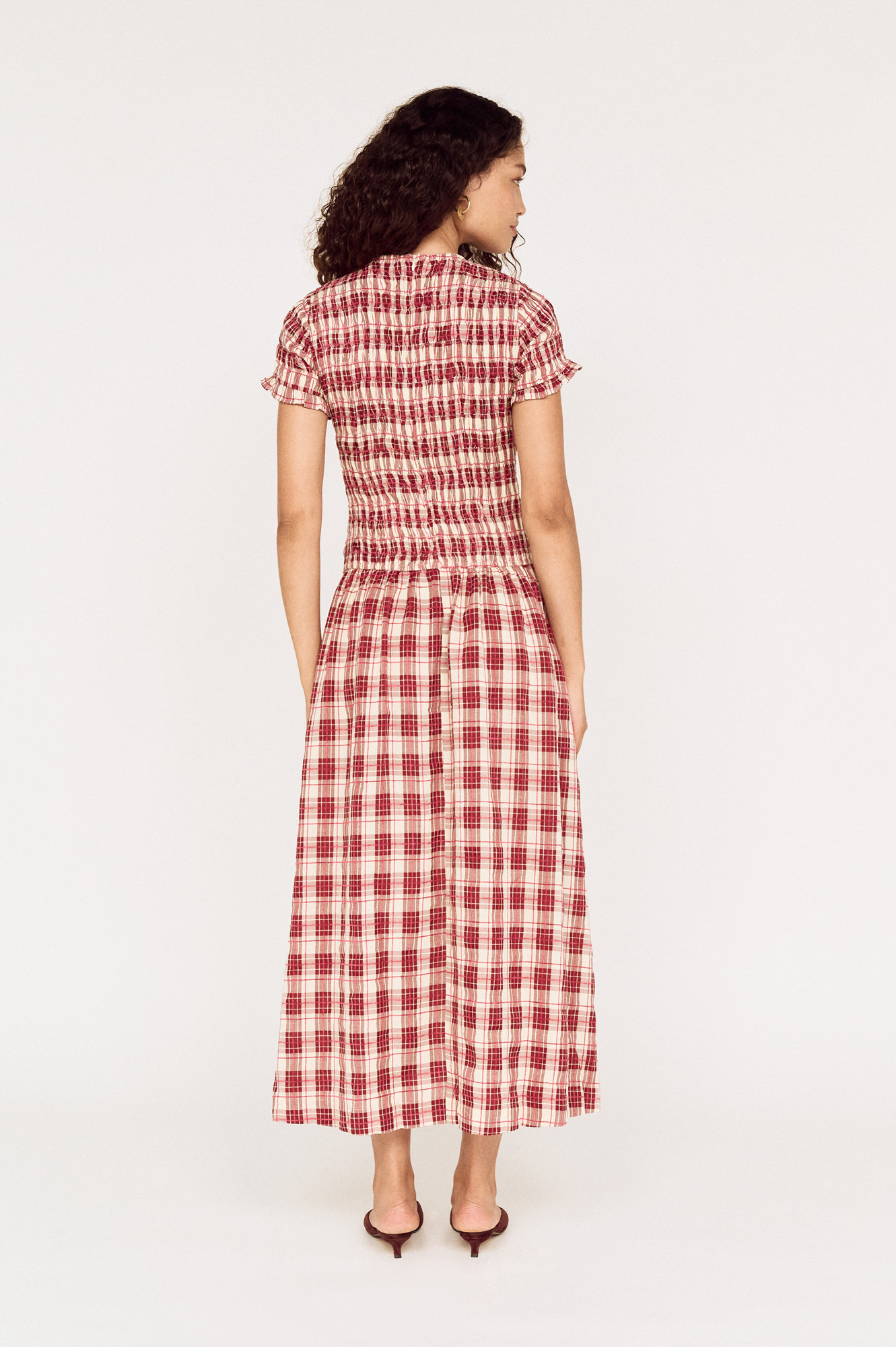 Back view of a model wearing a MINKPINK red check midi dress photographed for fashion e-commerce by Shoot.Studio in Sydney.