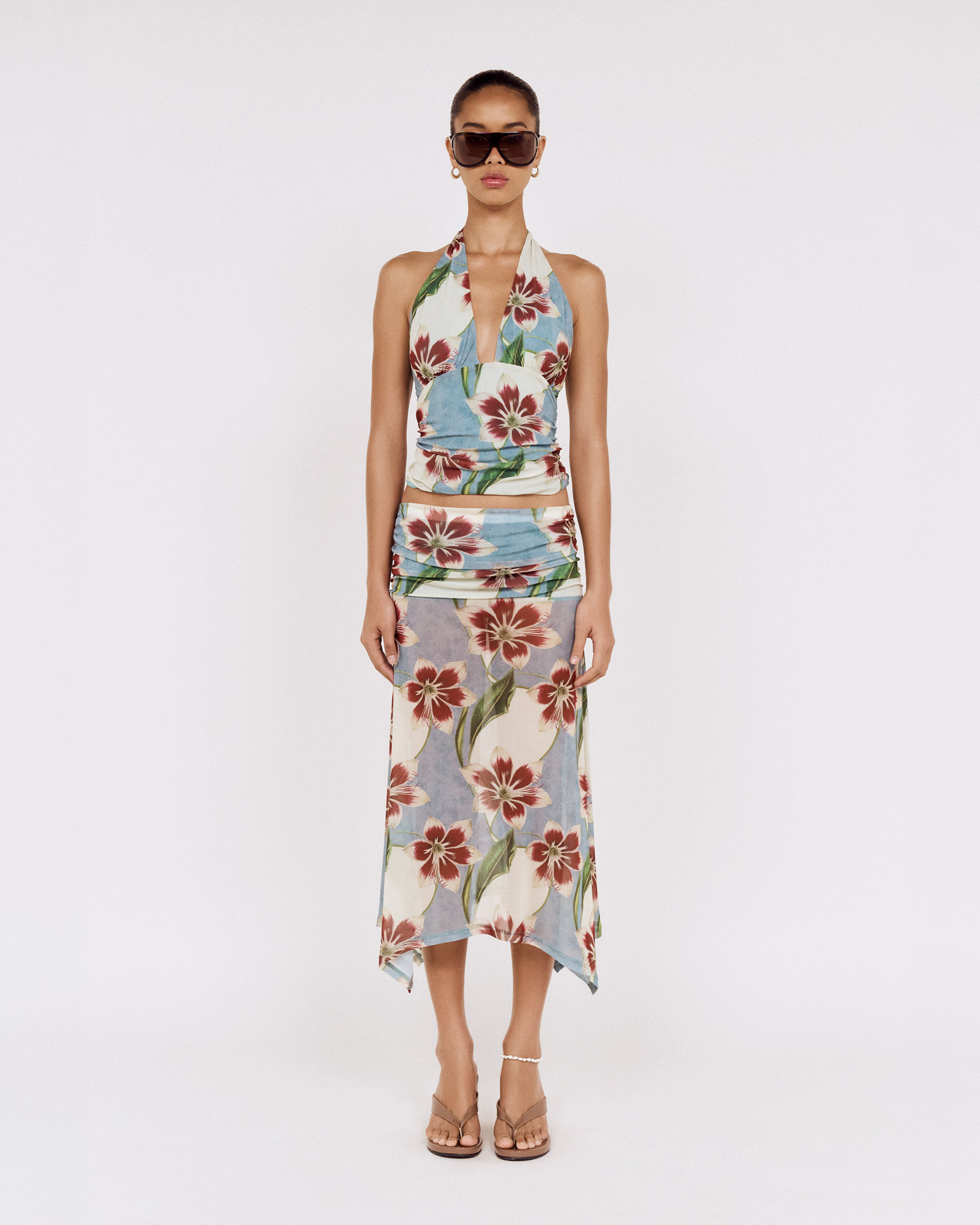 Front view of a model wearing a MINKPINK floral halter top and matching skirt, photographed for fashion e-commerce by Shoot.Studio in Sydney.
