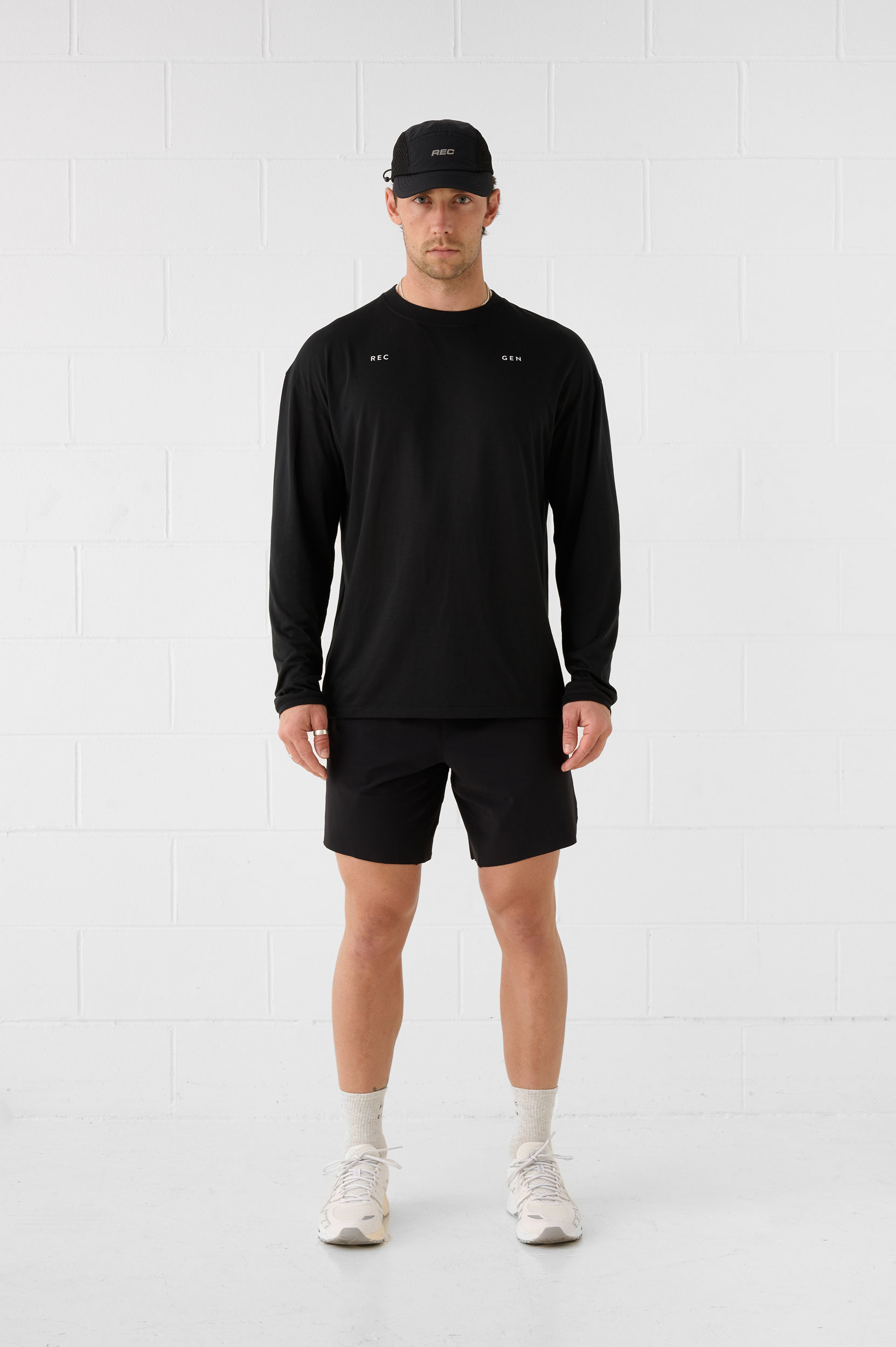 REC GEN men's black long-sleeve top and shorts, full-length front view