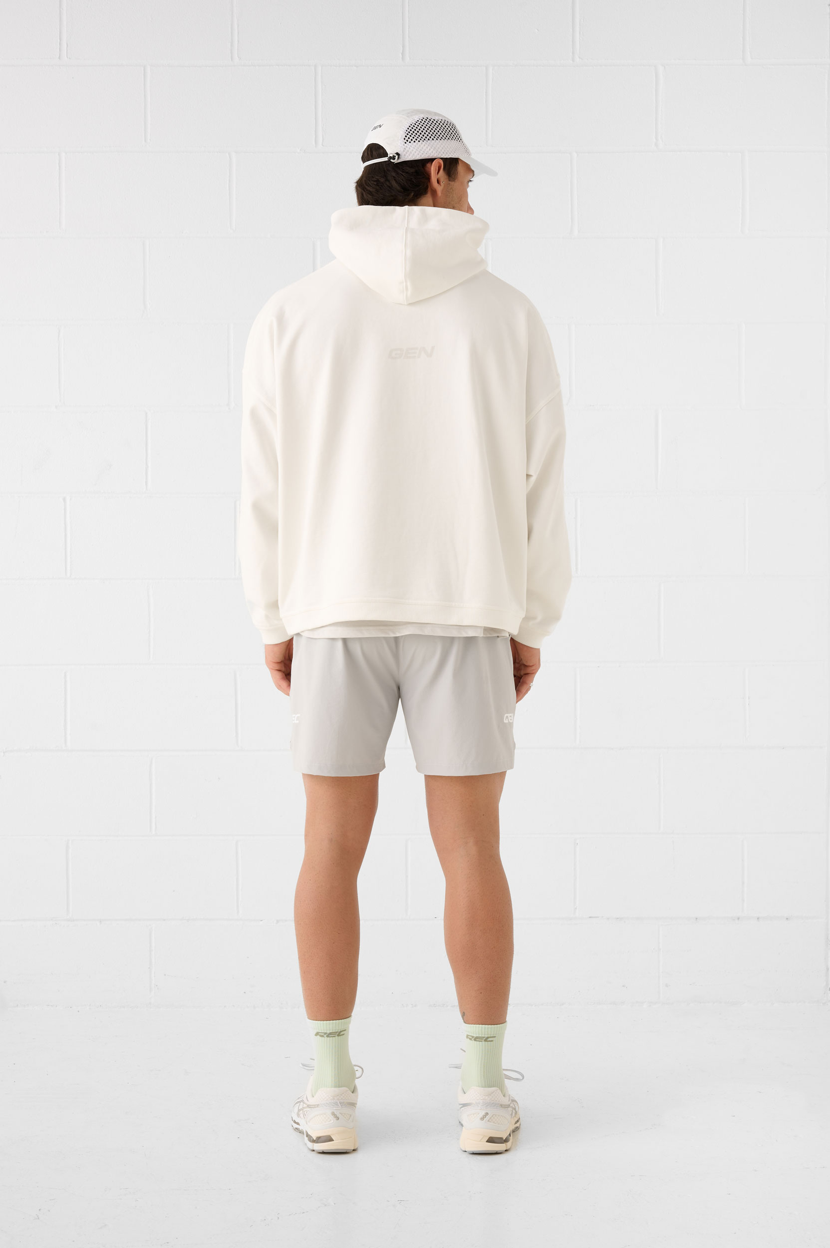 REC GEN men's cream hoodie and grey shorts, full-length back view