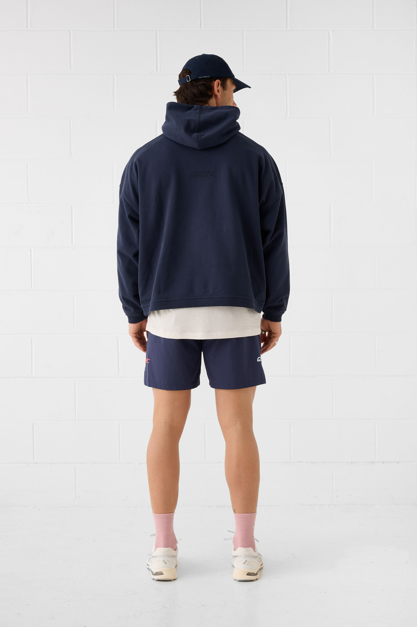 REC GEN men's navy hoodie and shorts, full-length back view