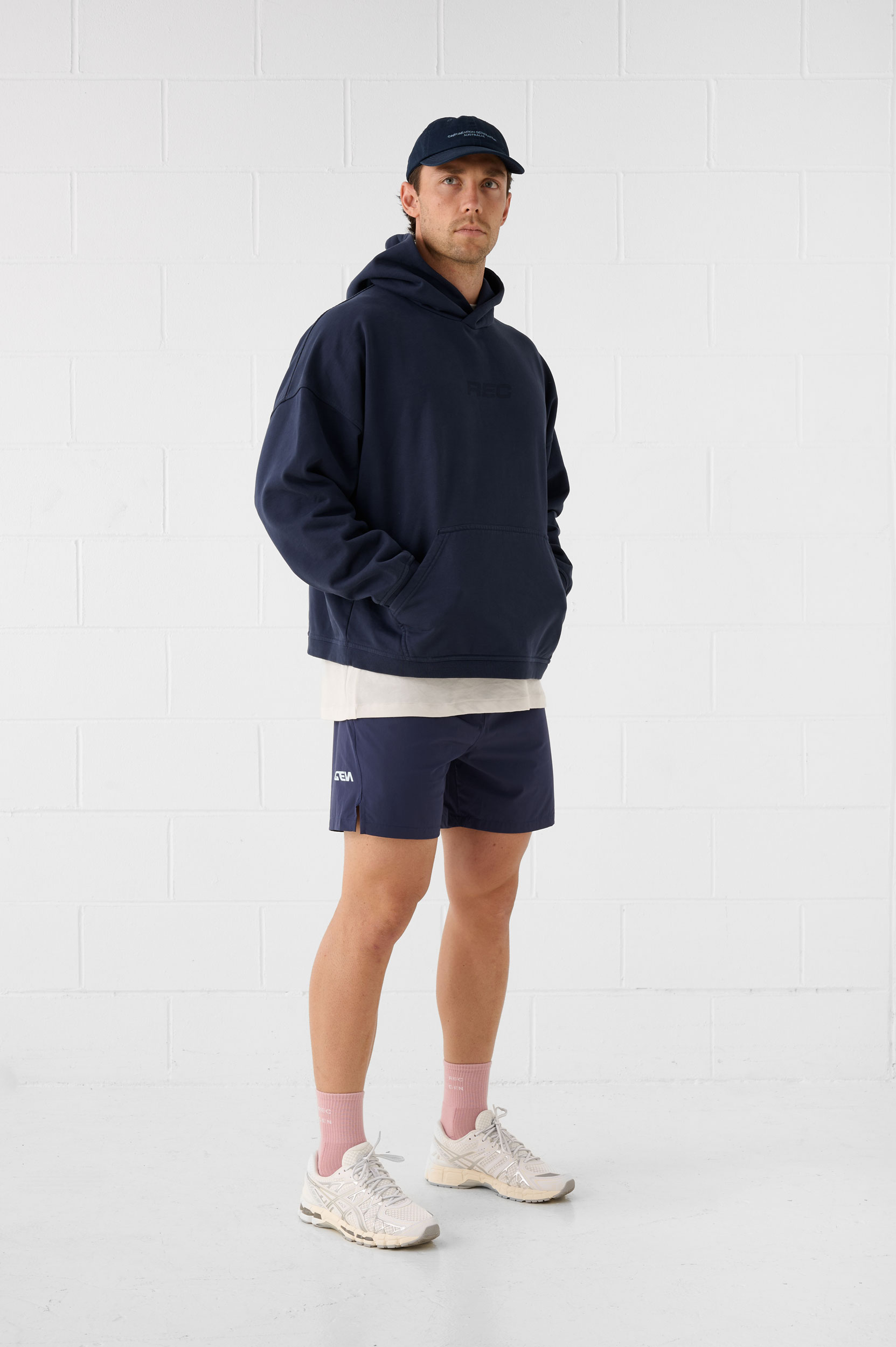 REC GEN men's navy hoodie and shorts, full-length side view