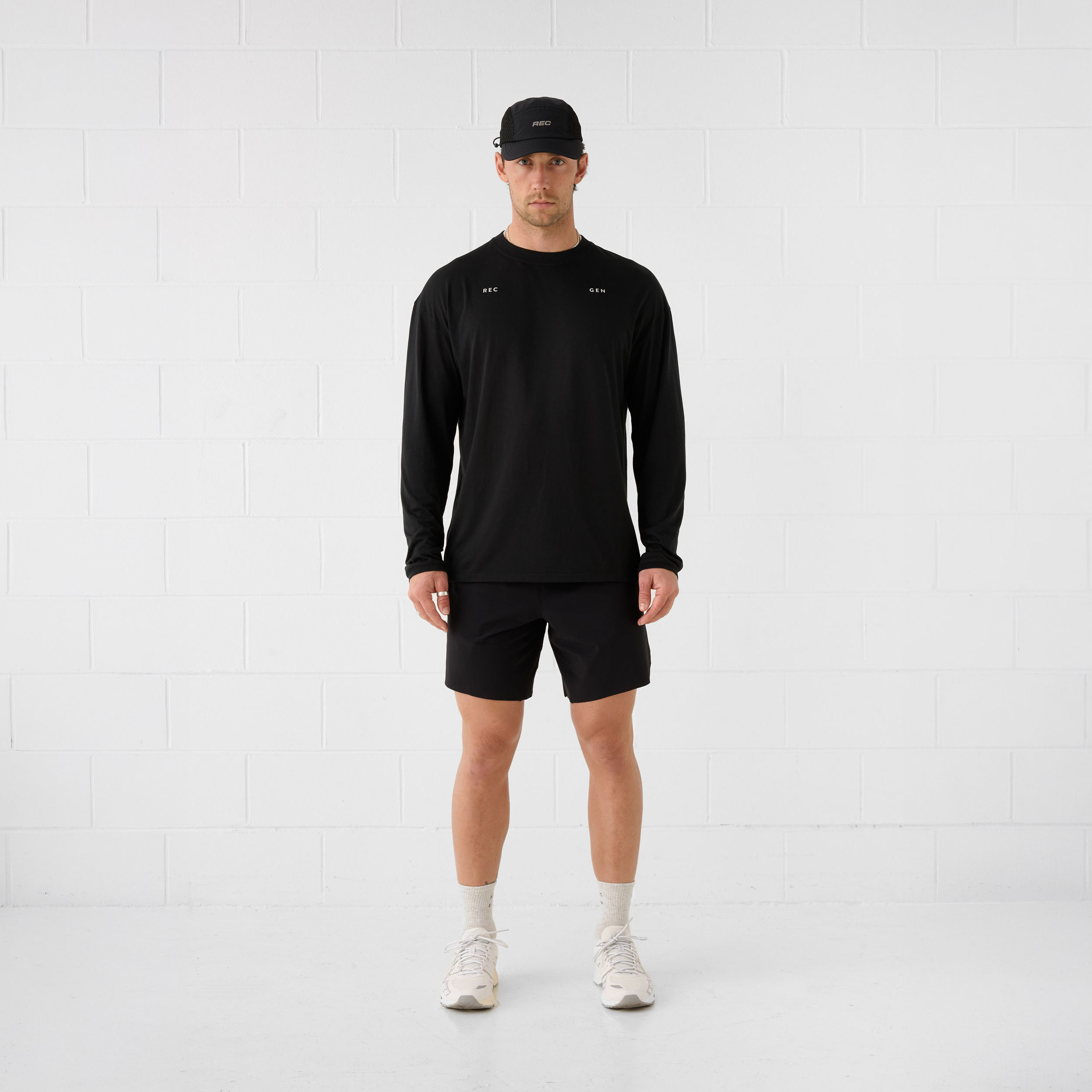 REC GEN men's black long-sleeve top and shorts, full-length front view